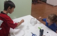 We made paper mache masks.  We made our own paste out of flour and water.  After the paper mache dried we painted the masks.